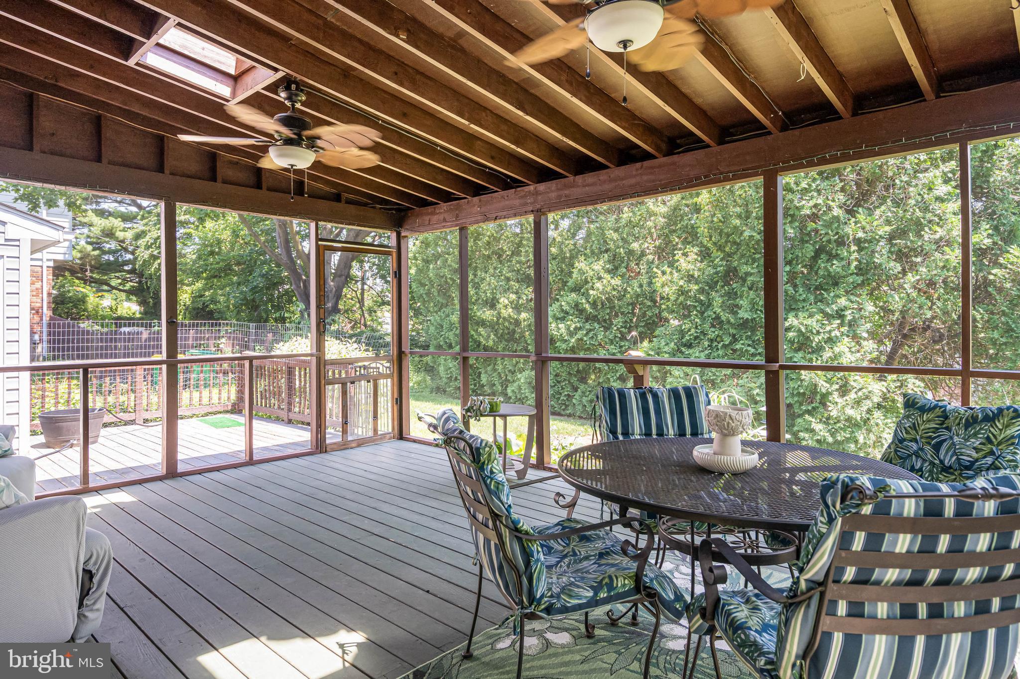 121 Decker Drive Newark, DE 19711 - Photo 31 of 57 a view of a patio with table and chairs and wooden floor