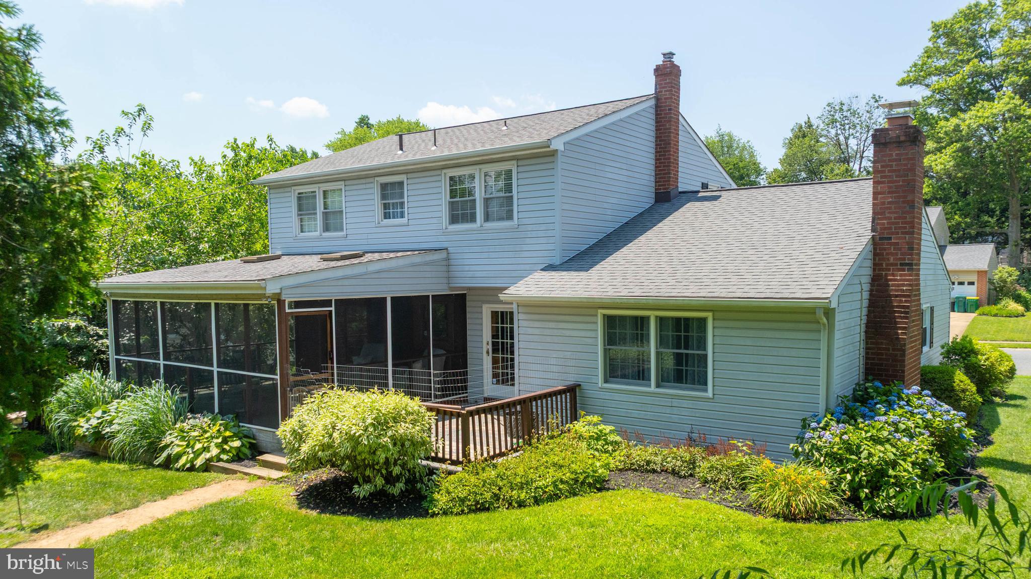 121 Decker Drive Newark, DE 19711 - Photo 38 of 57 a view of a house with potted plants and a large tree