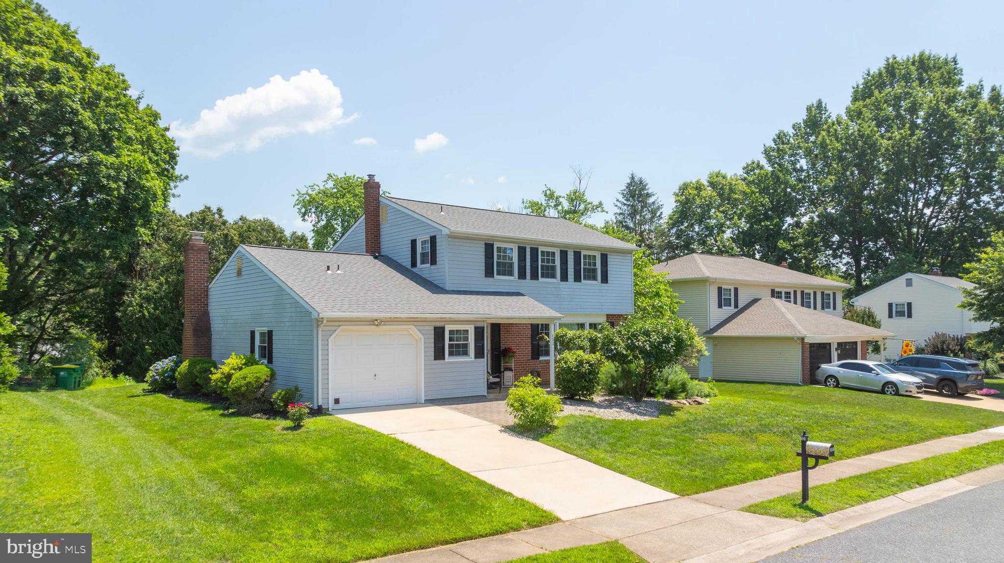 121 Decker Drive Newark, DE 19711 - Photo 40 of 57 a front view of a house with a yard and garage