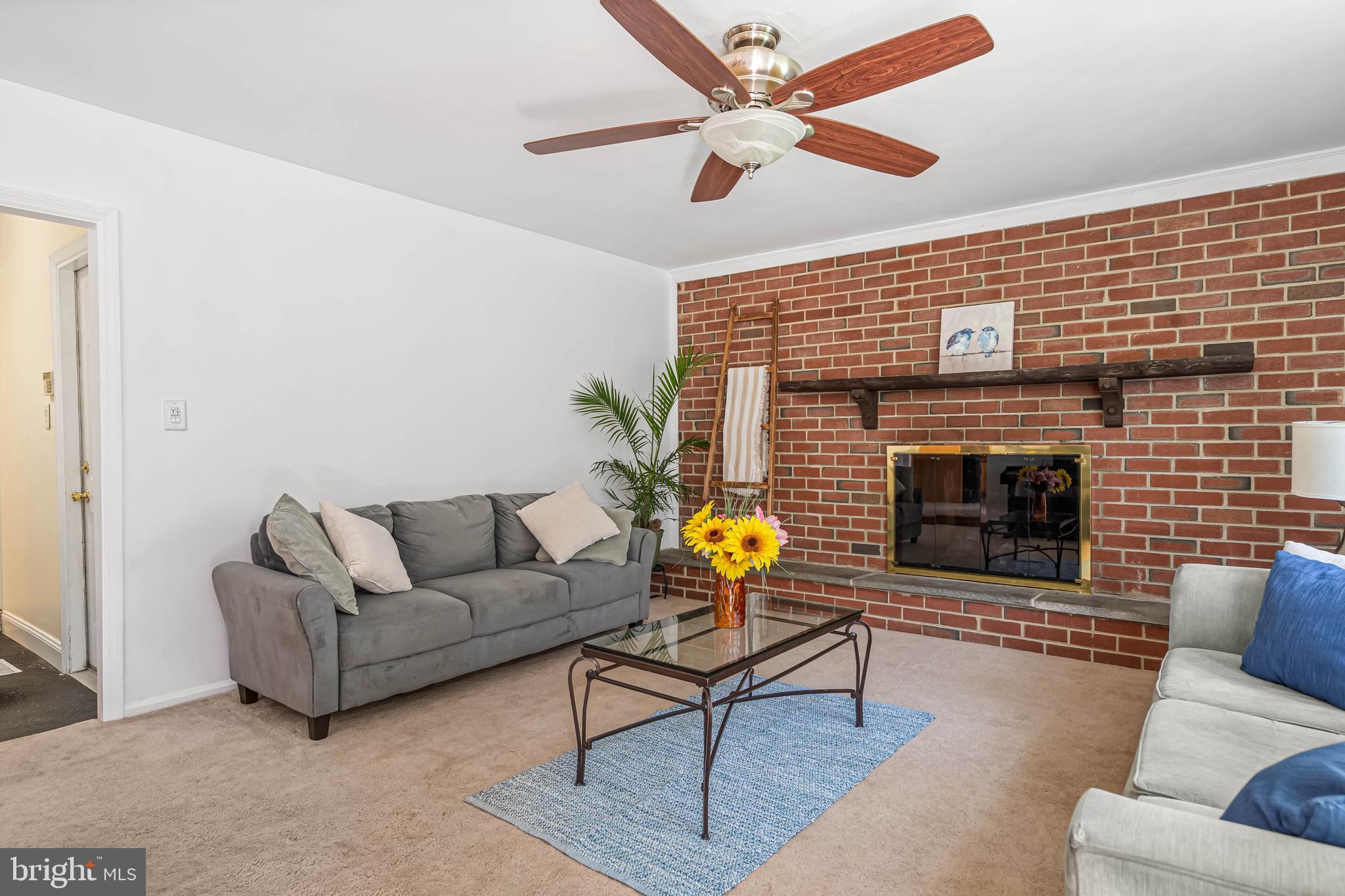 121 Decker Drive Newark, DE 19711 - Photo 7 of 57 a living room with furniture and a fireplace