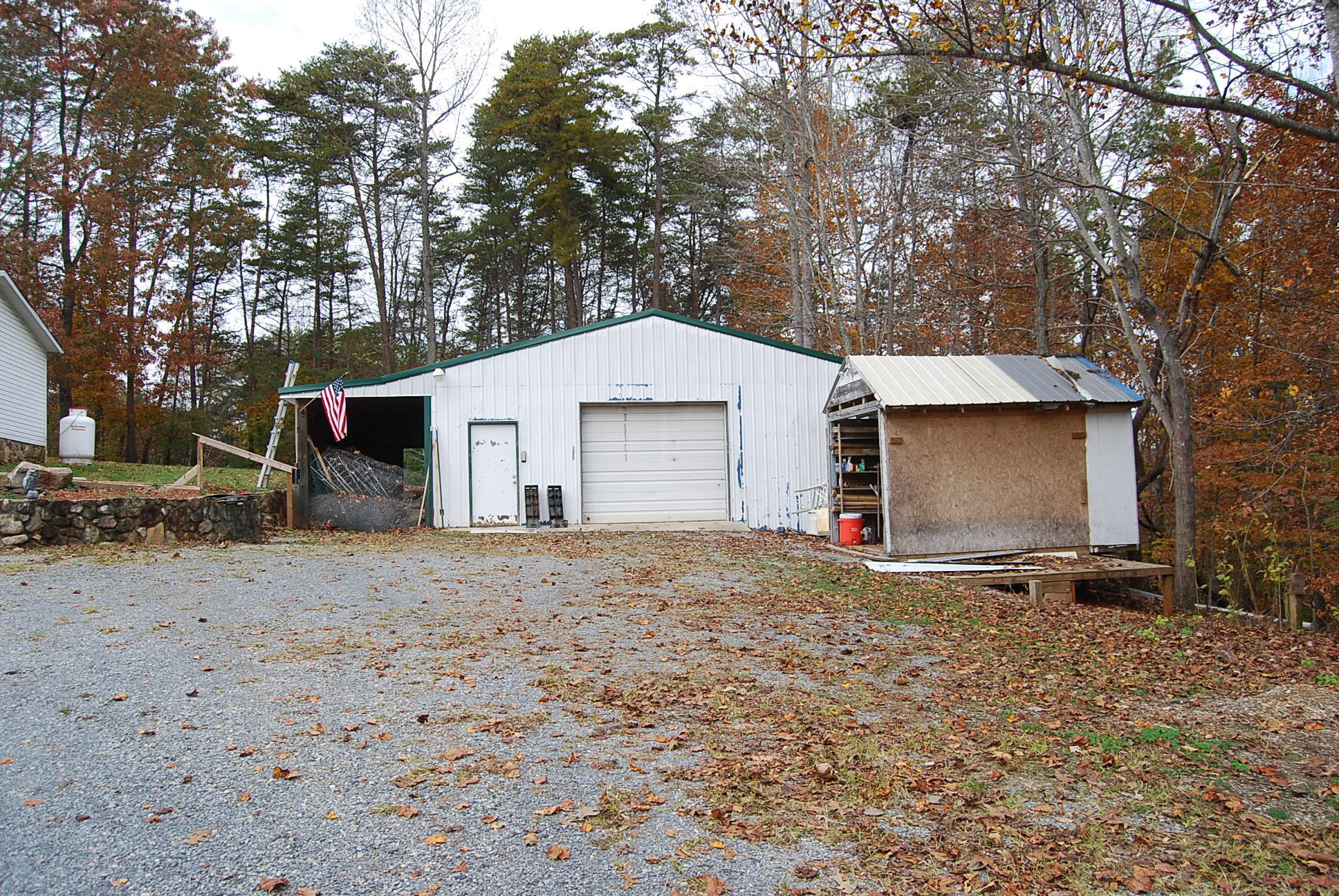 1019 Doe Mountain Road Goodview, VA 24095 - Photo 2 of 53 a front view of a house with a yard and garage