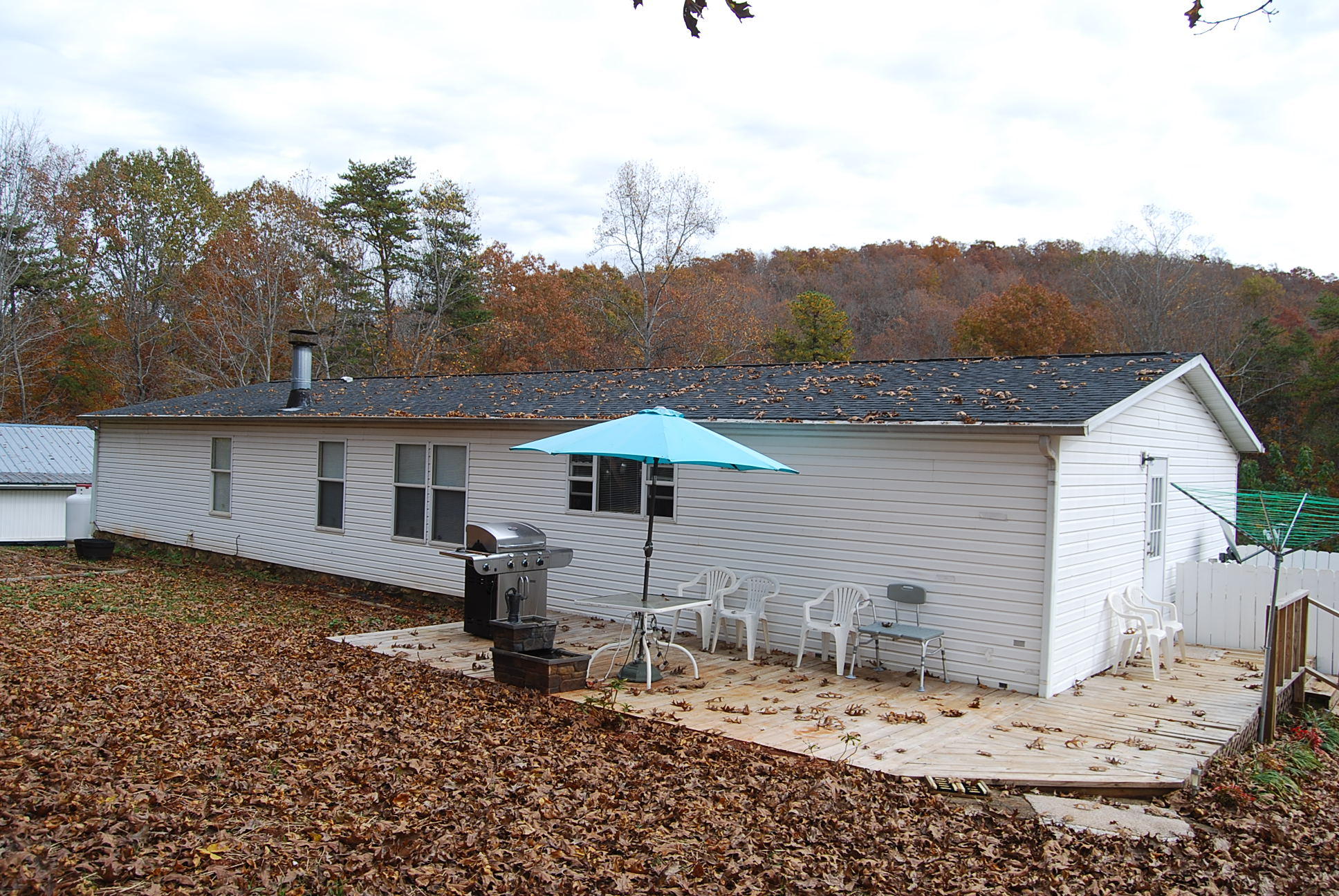1019 Doe Mountain Road Goodview, VA 24095 - Photo 16 of 53 a view of a house with backyard and sitting area