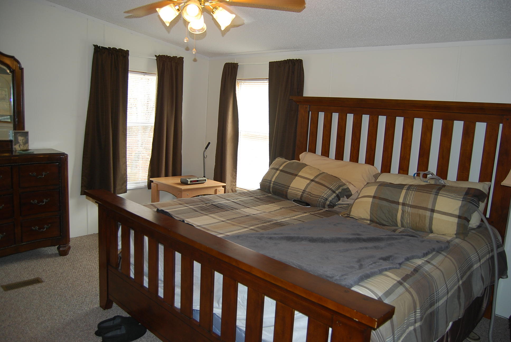 1019 Doe Mountain Road Goodview, VA 24095 - Photo 31 of 53 a bedroom with two beds and a chandelier