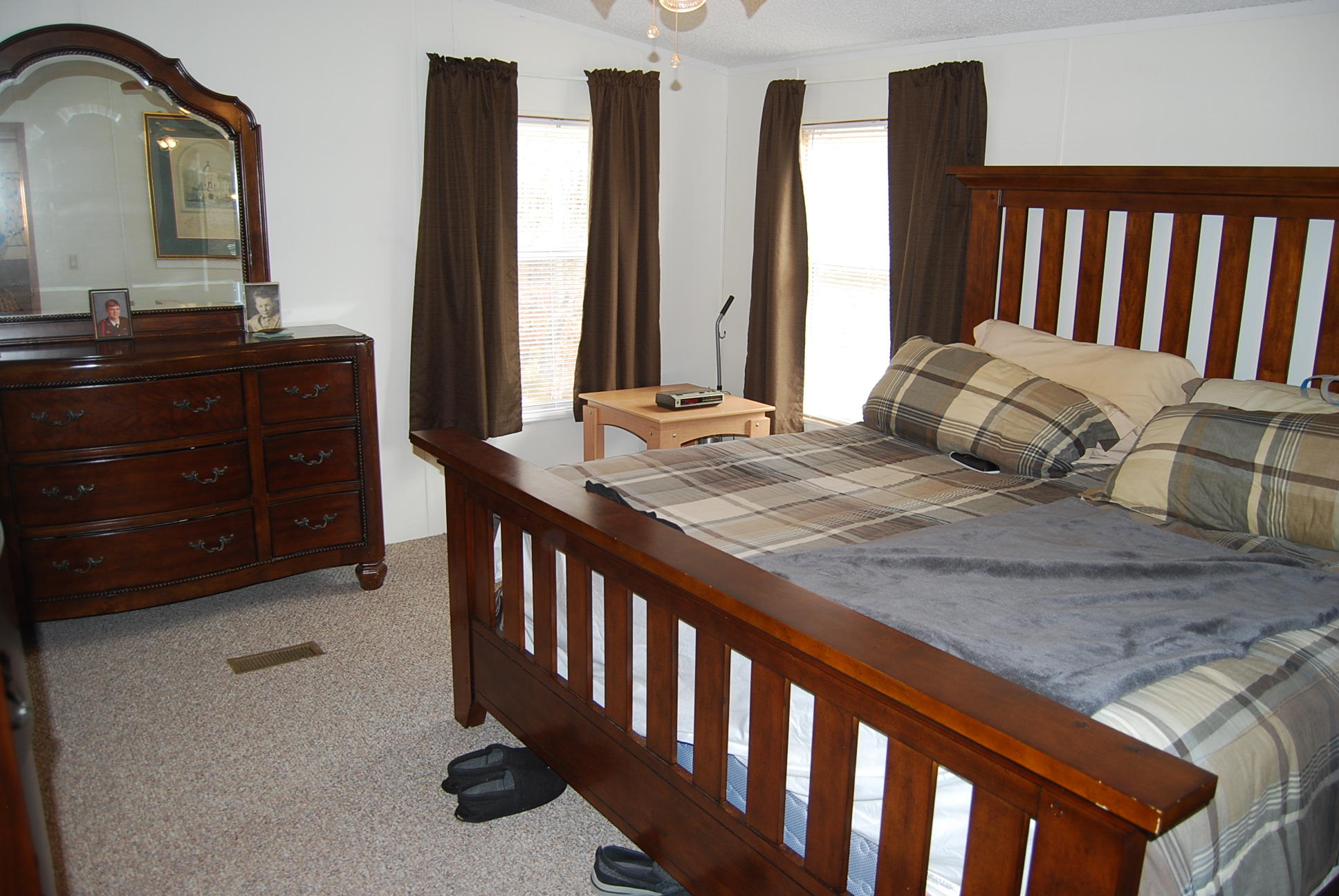1019 Doe Mountain Road Goodview, VA 24095 - Photo 33 of 53 a bedroom with furniture and a mirror
