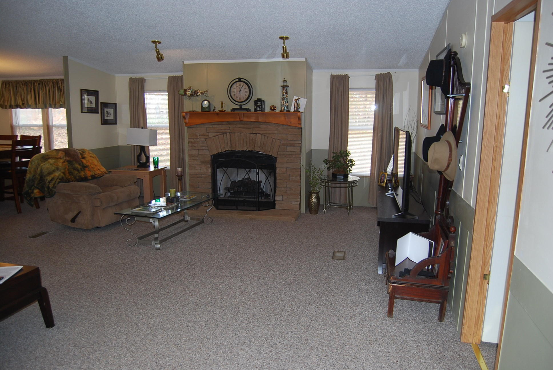 1019 Doe Mountain Road Goodview, VA 24095 - Photo 35 of 53 a living room with furniture and a fireplace