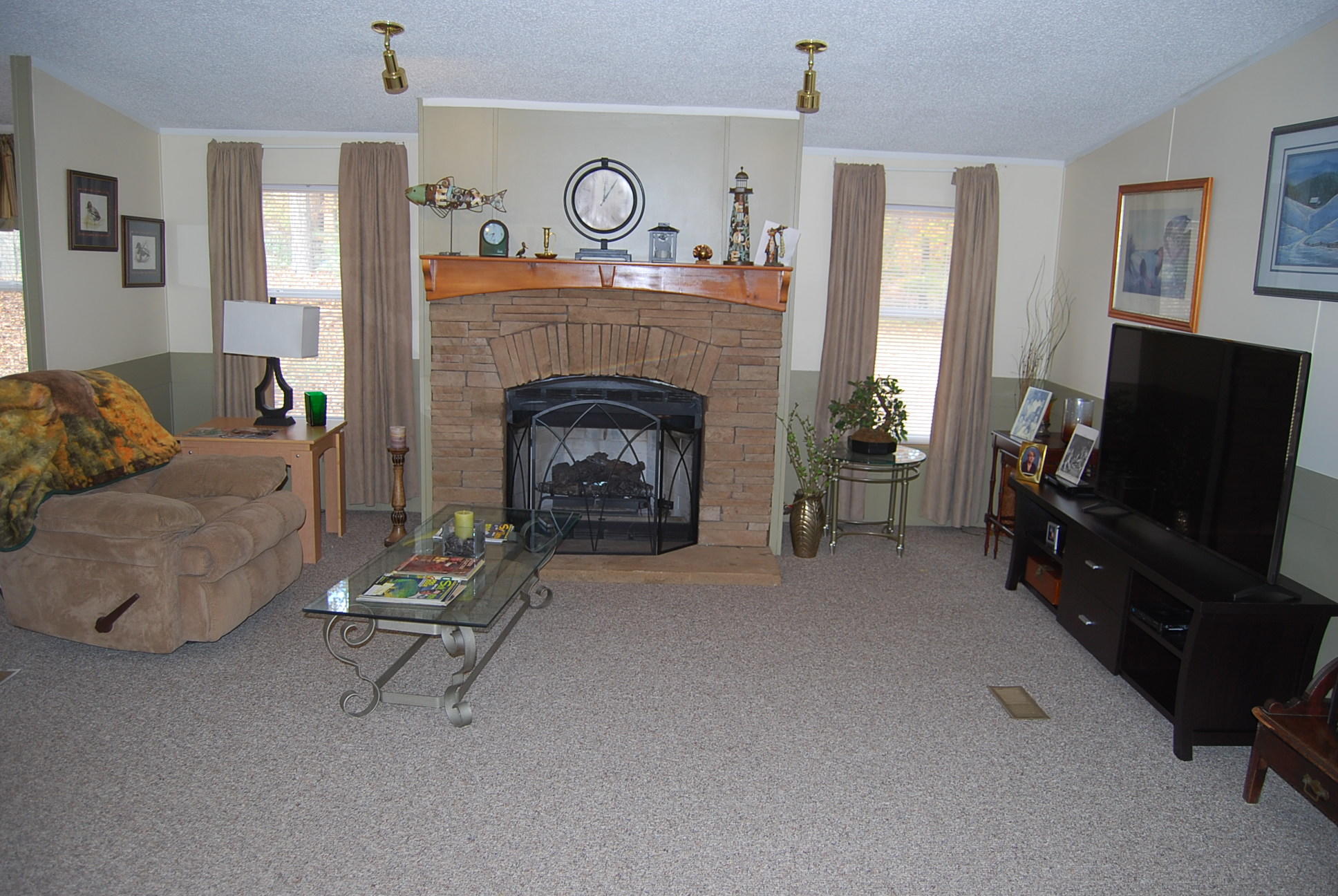 1019 Doe Mountain Road Goodview, VA 24095 - Photo 37 of 53 a living room with furniture and a fireplace