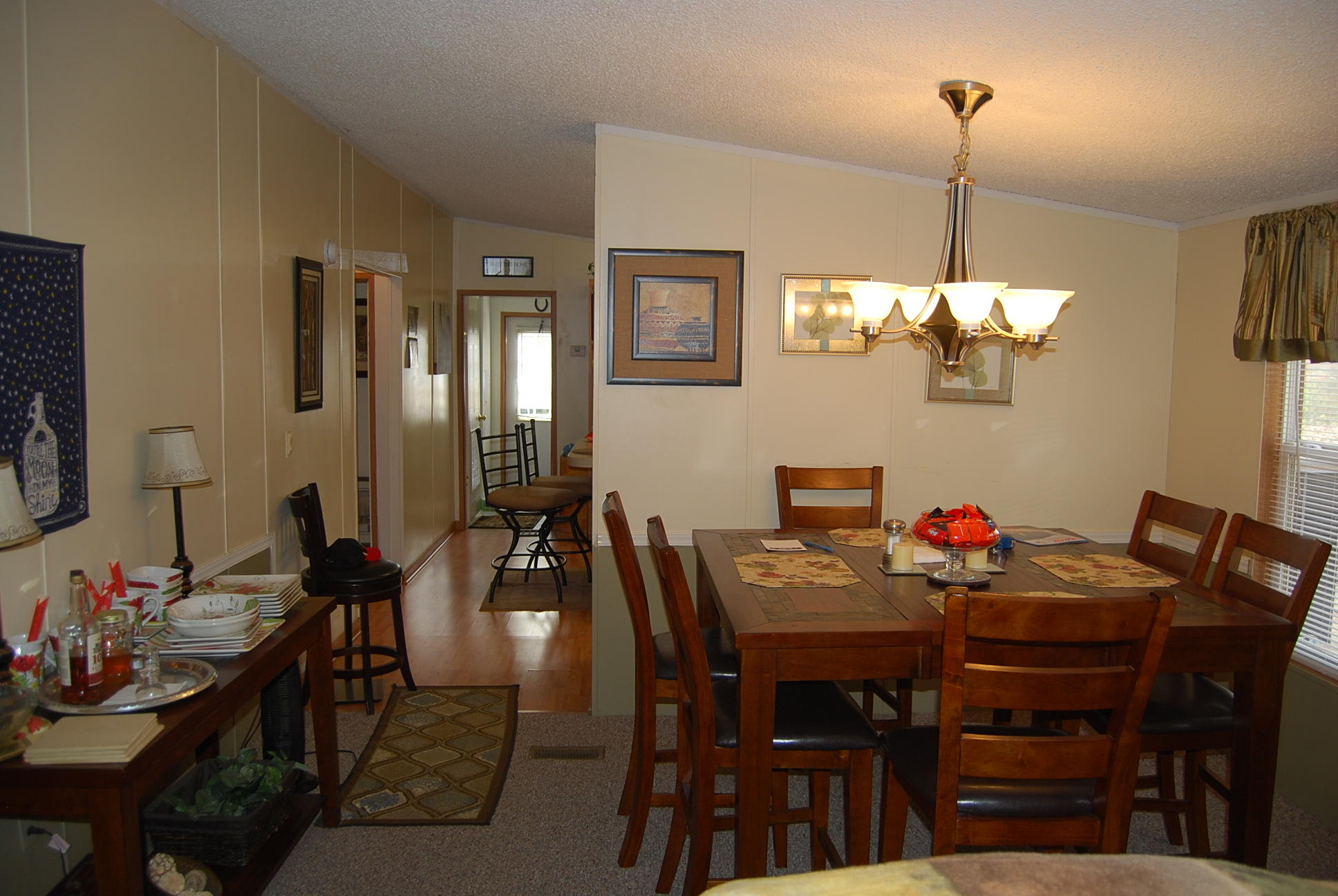 1019 Doe Mountain Road Goodview, VA 24095 - Photo 39 of 53 a view of a dining room with furniture and chandelier