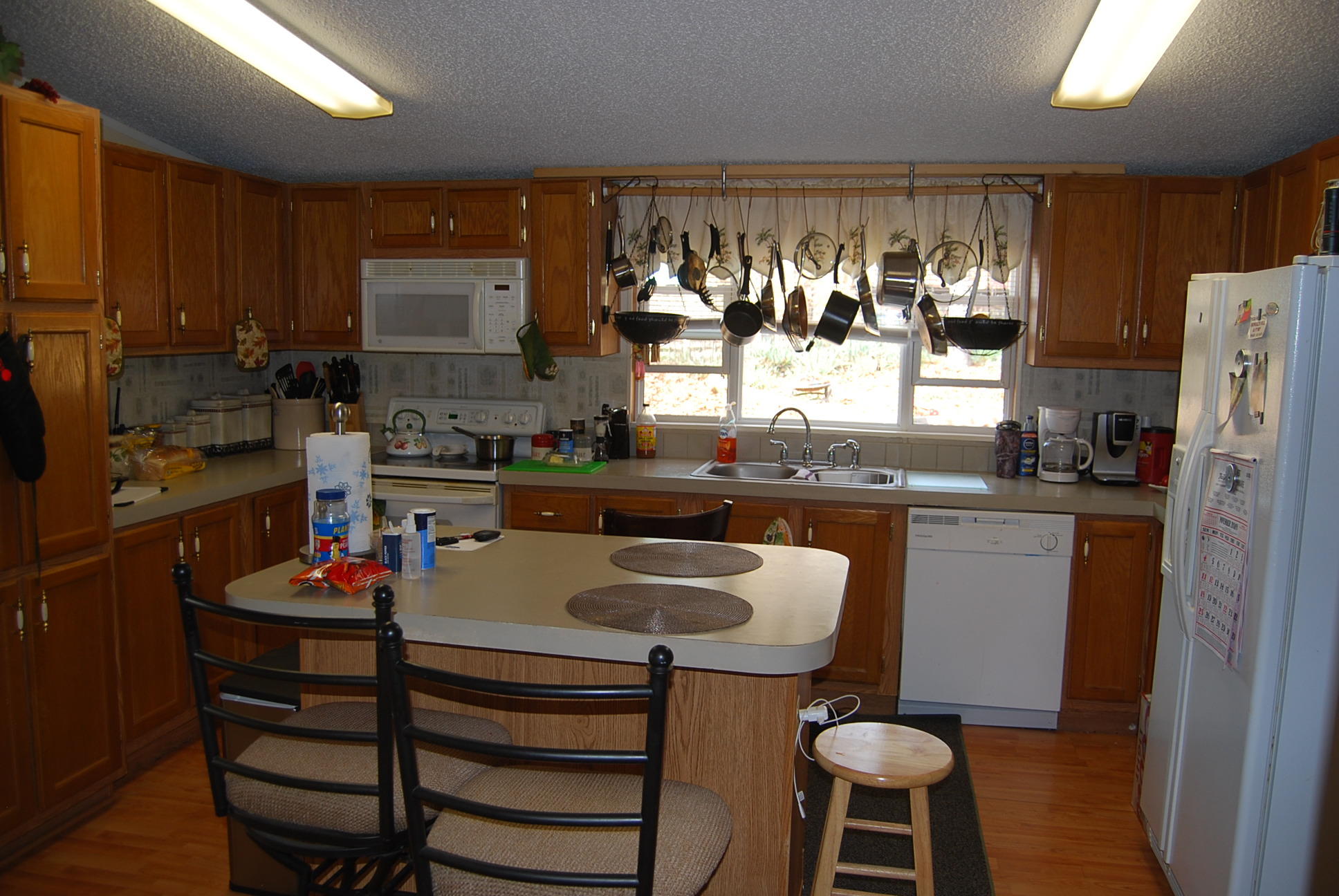 1019 Doe Mountain Road Goodview, VA 24095 - Photo 41 of 53 a kitchen with a sink cabinets and appliances