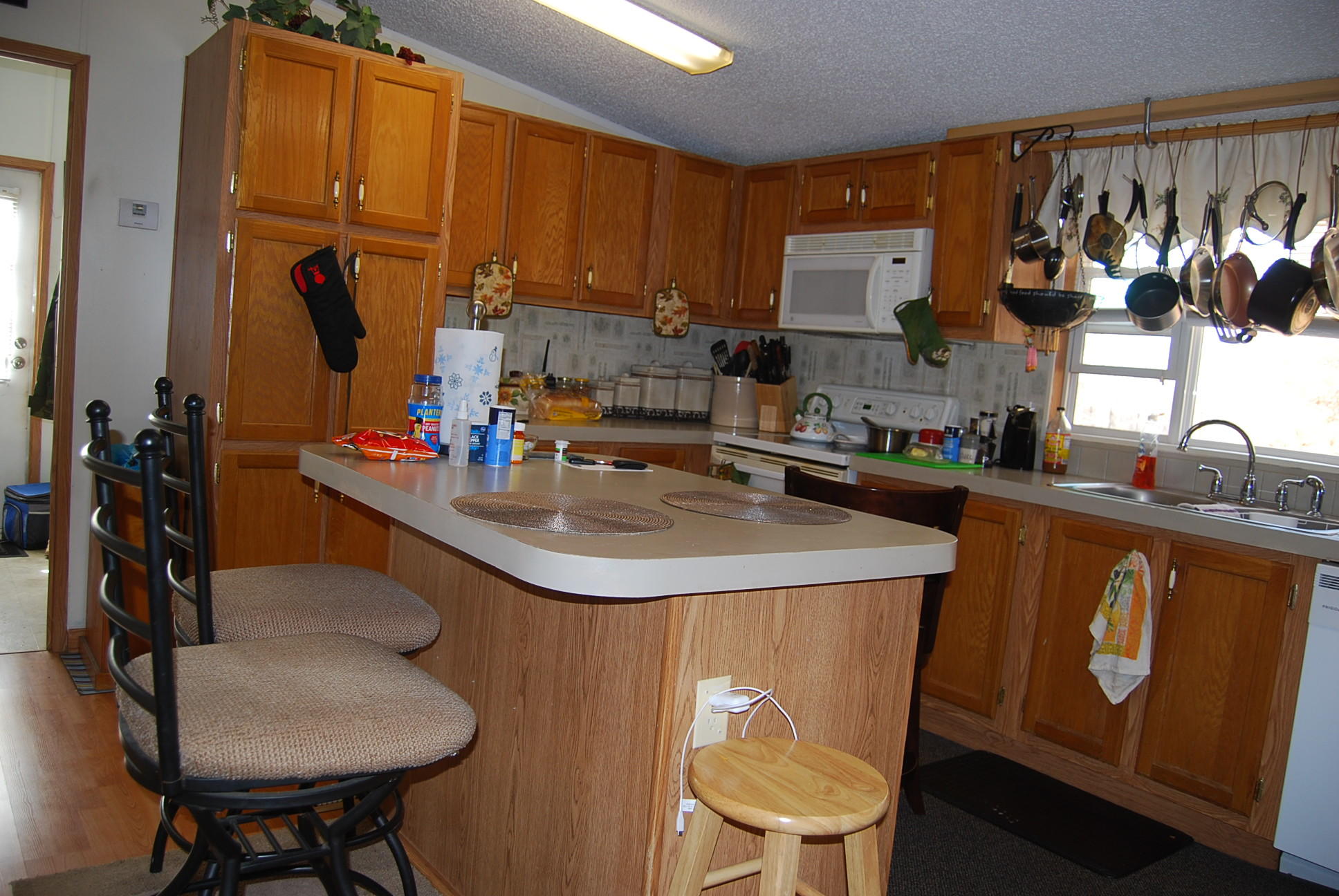 1019 Doe Mountain Road Goodview, VA 24095 - Photo 42 of 53 a kitchen with stainless steel appliances granite countertop a sink a stove and a refrigerator