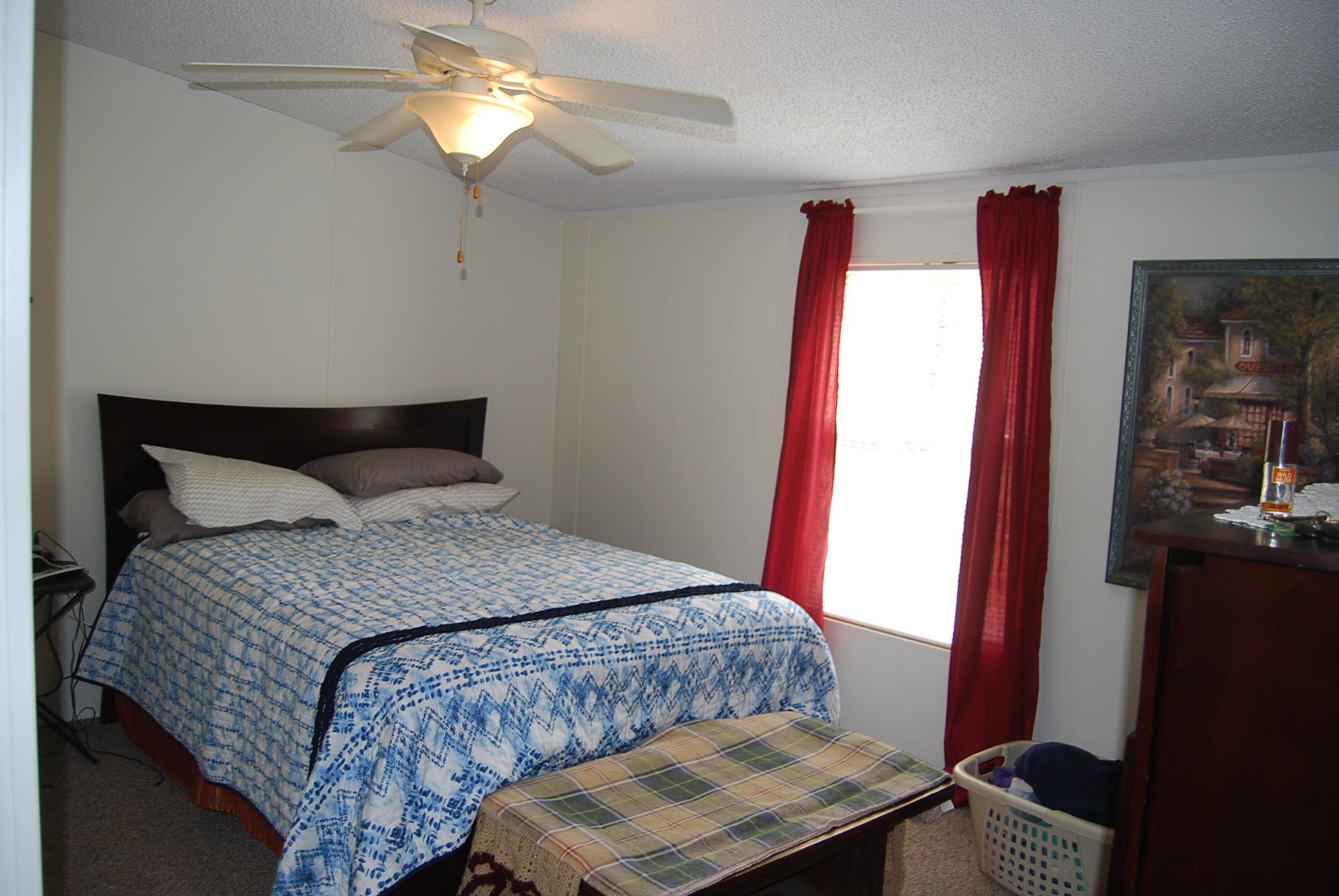 1019 Doe Mountain Road Goodview, VA 24095 - Photo 49 of 53 a bedroom with a bed and a mirror