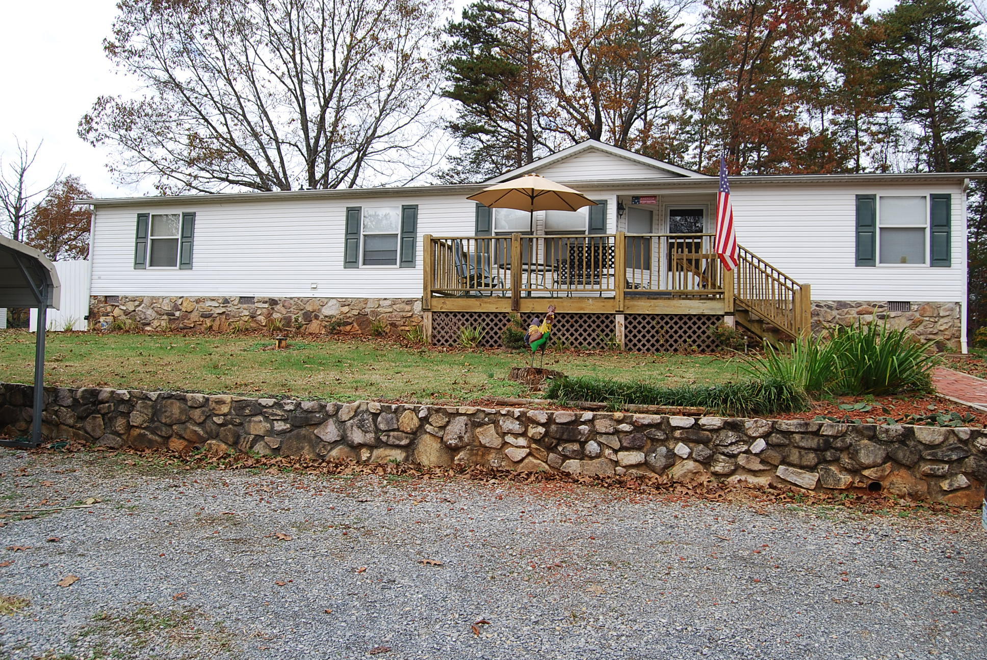1019 Doe Mountain Road Goodview, VA 24095 - Photo 6 of 53 a front view of a house with garden