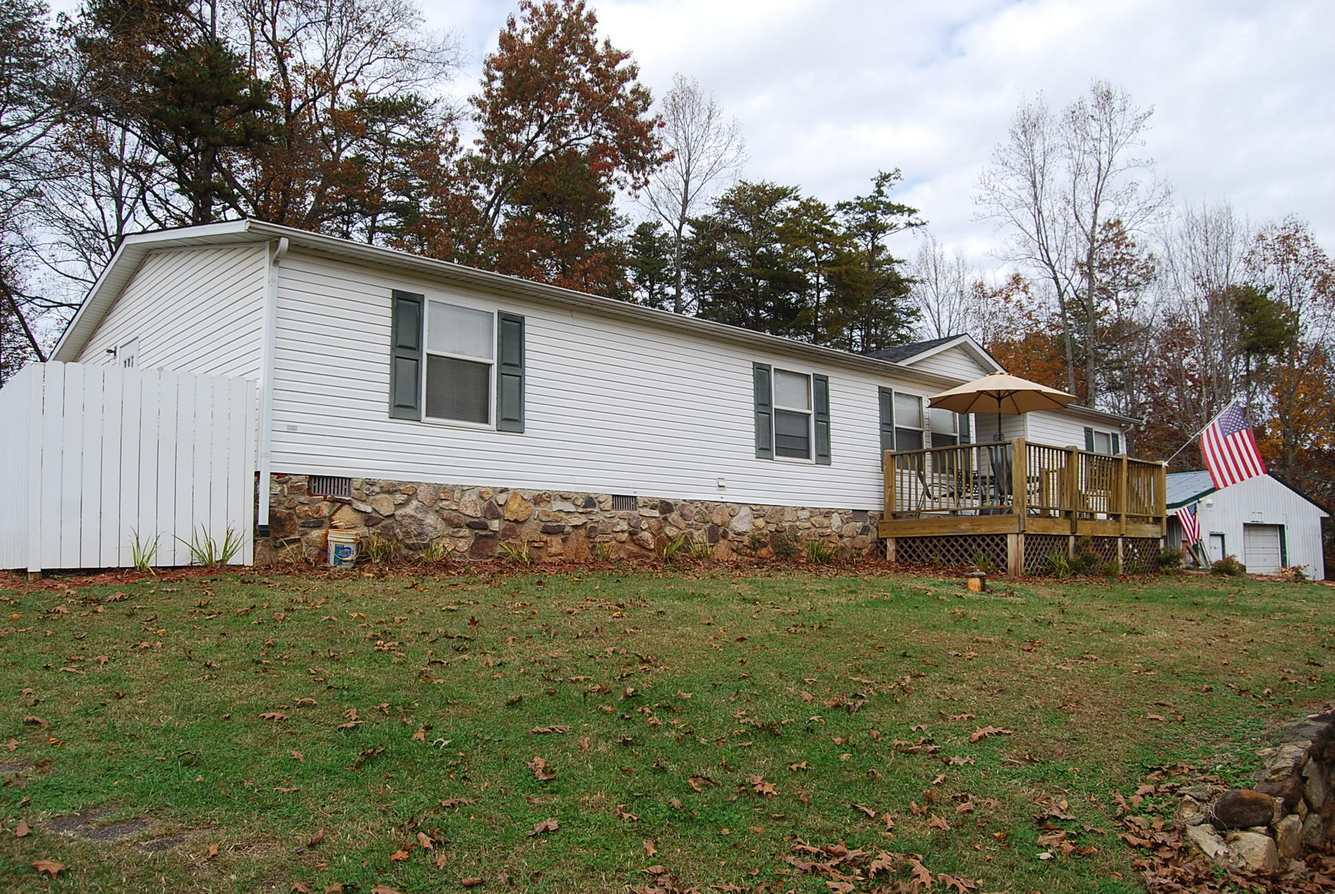 1019 Doe Mountain Road Goodview, VA 24095 - Photo 10 of 53 a view of a house with a yard