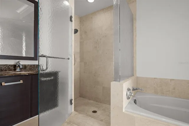 a bathroom with a bathtub and a sink