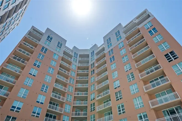 a view of an apartment with a garden and sitting area
