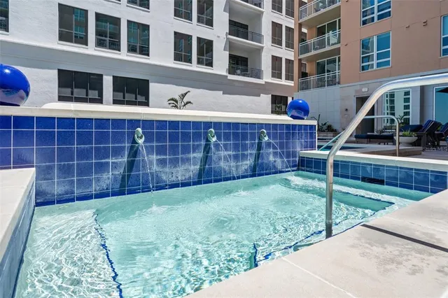 a view of a patio with couches table and chairs potted plants