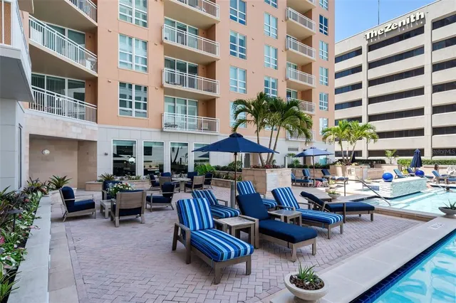 a view of a dinning table and chairs in the patio