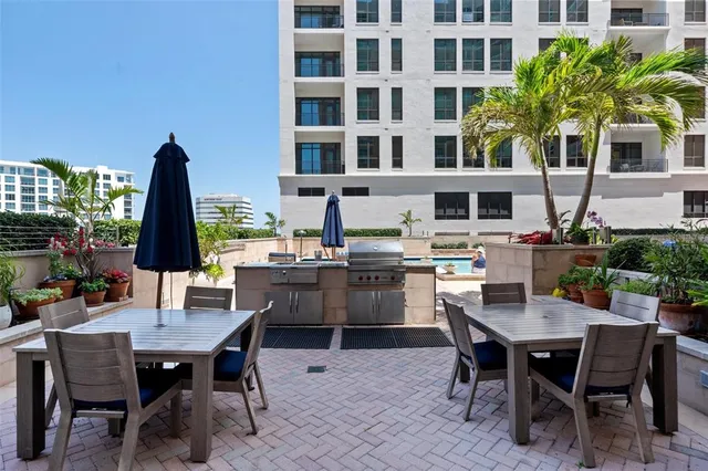 a view of a hallway to a livingroom with furniture
