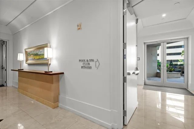 a living room with a couch and a table with wooden floor