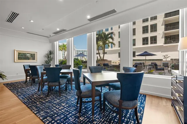 a living room with furniture and a book shelf