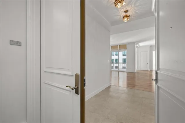a view of an entryway with a chandelier