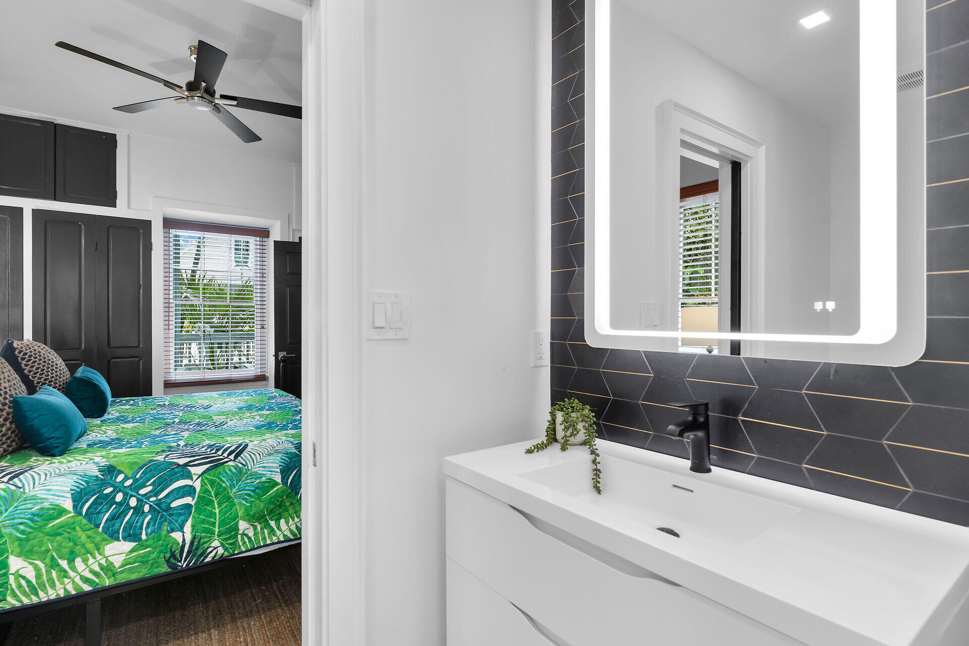 1015 Eaton Street Key West, FL 33040 - Photo 12 of 36 a bathroom with a sink and a mirror