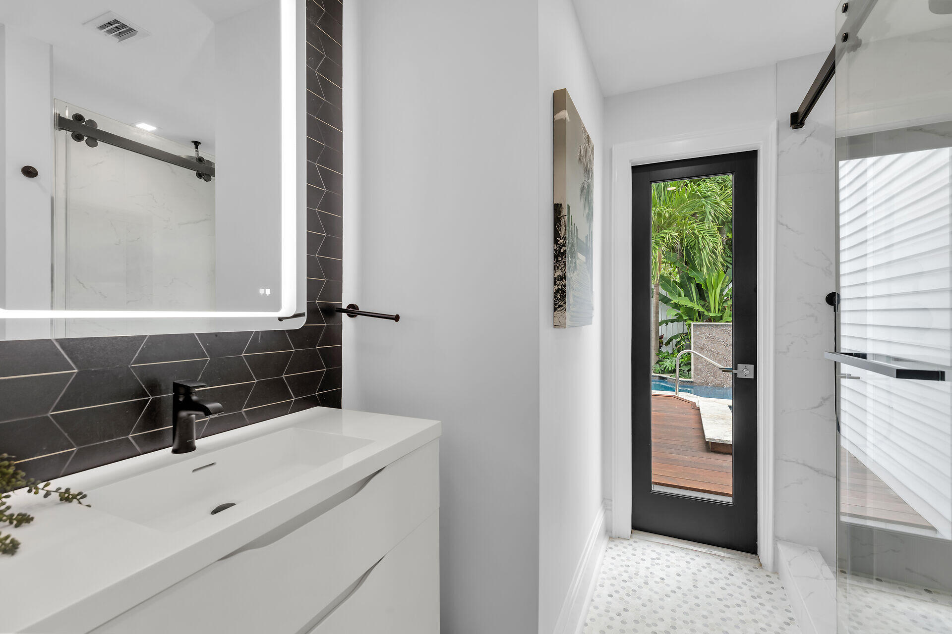 1015 Eaton Street Key West, FL 33040 - Photo 13 of 36 a bathroom with a sink and a mirror