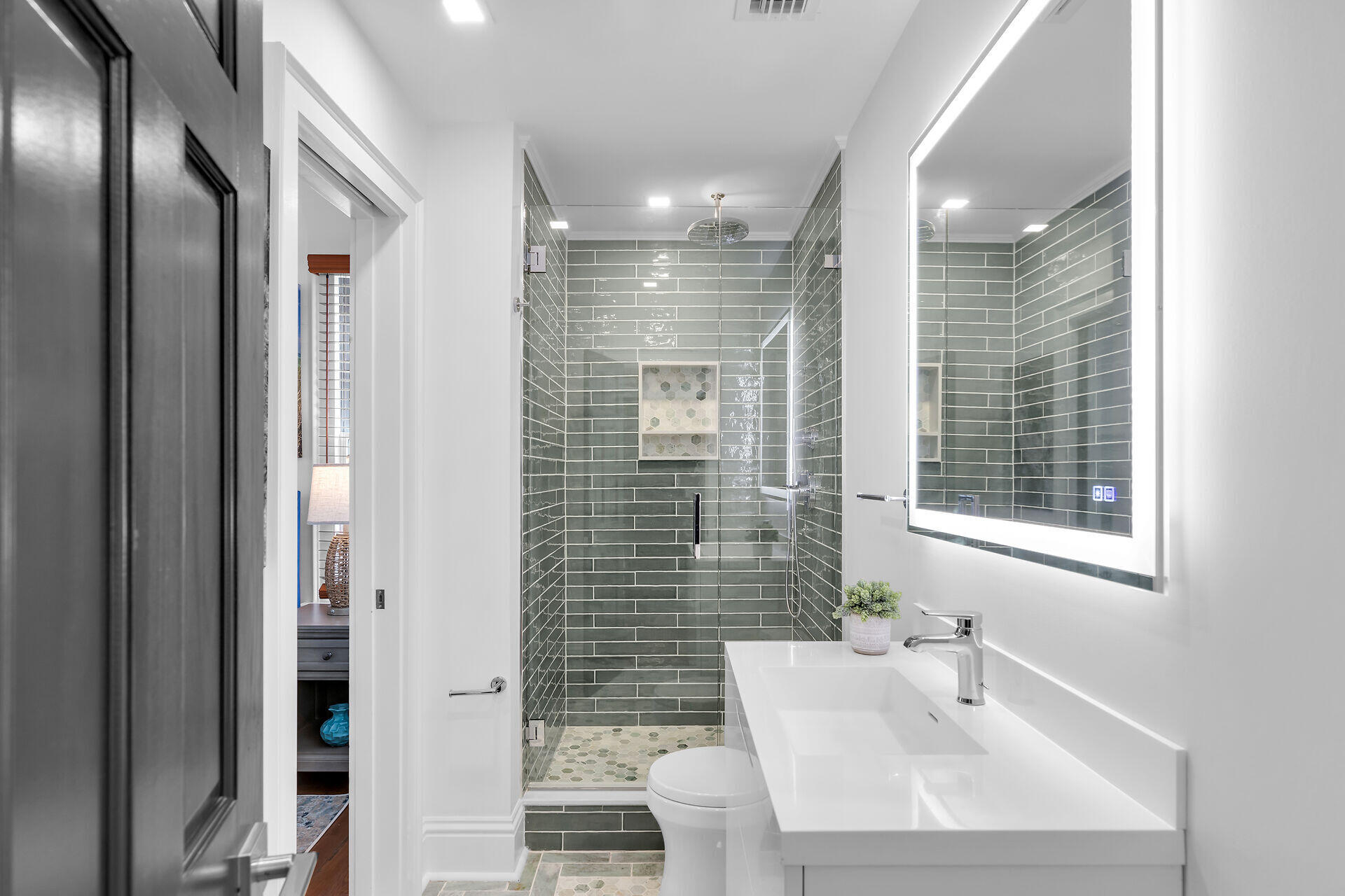 1015 Eaton Street Key West, FL 33040 - Photo 18 of 36 a bathroom with a sink shower and a mirror