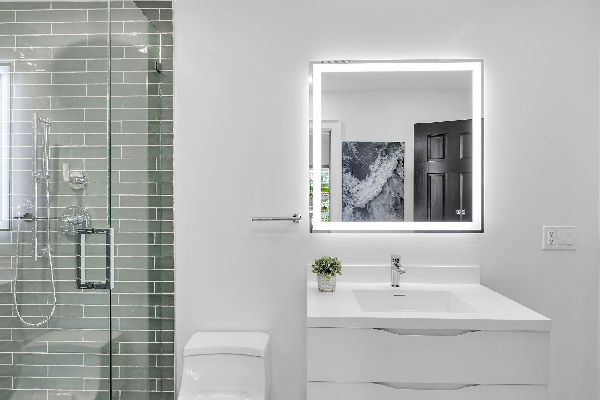 1015 Eaton Street Key West, FL 33040 - Photo 19 of 36 a bathroom with a sink a toilet and mirror