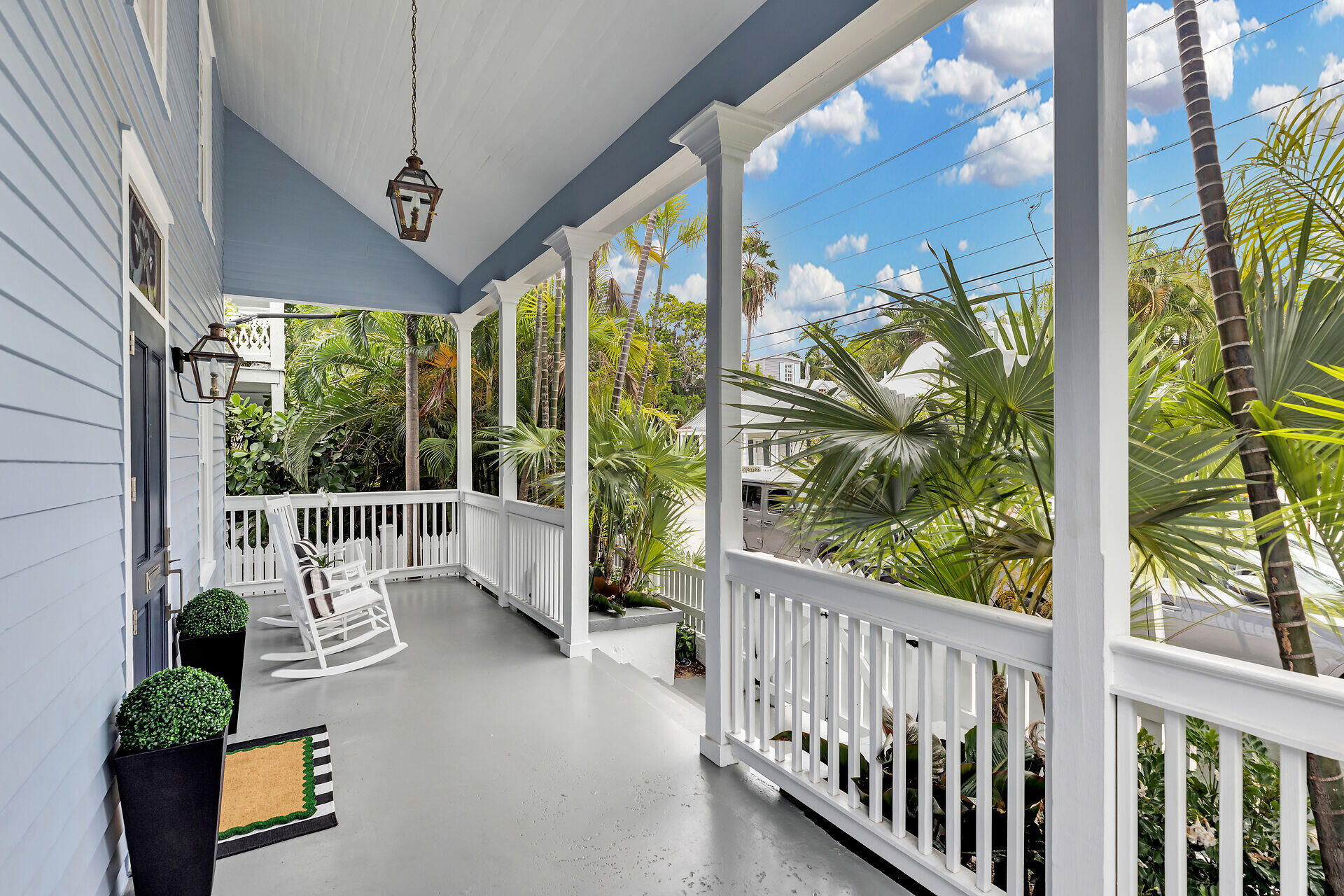 1015 Eaton Street Key West, FL 33040 - Photo 2 of 36 a porch with chairs and table in patio