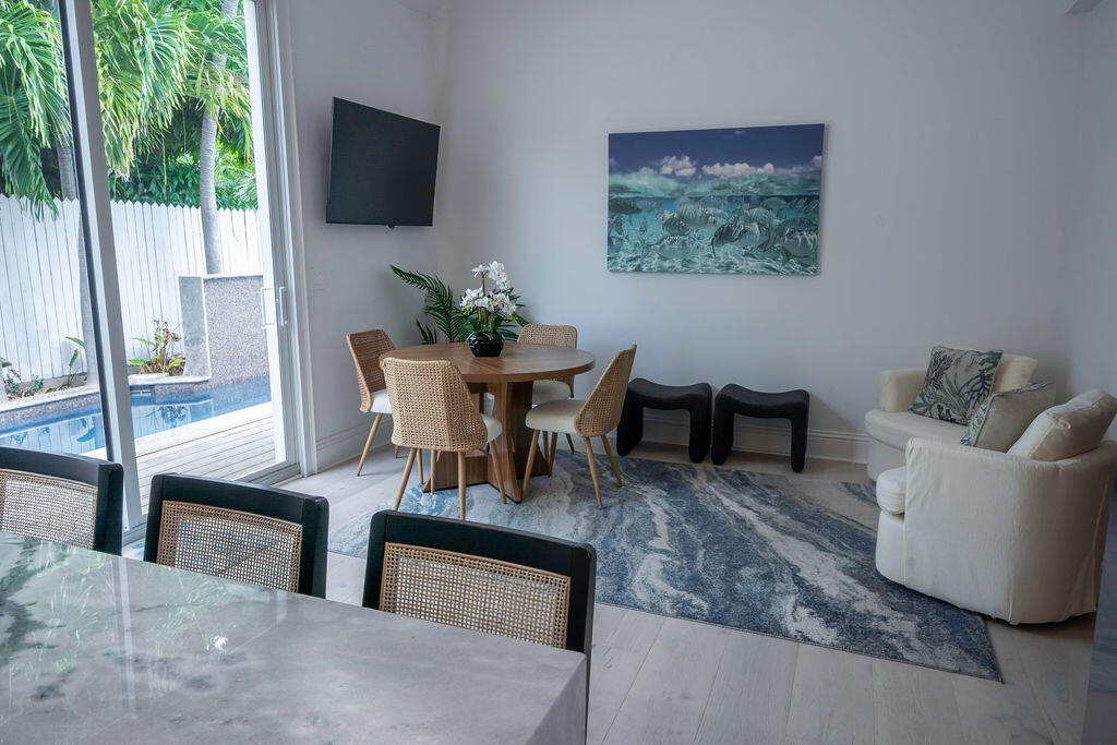 1015 Eaton Street Key West, FL 33040 - Photo 24 of 36 a living room with furniture and a flat screen tv