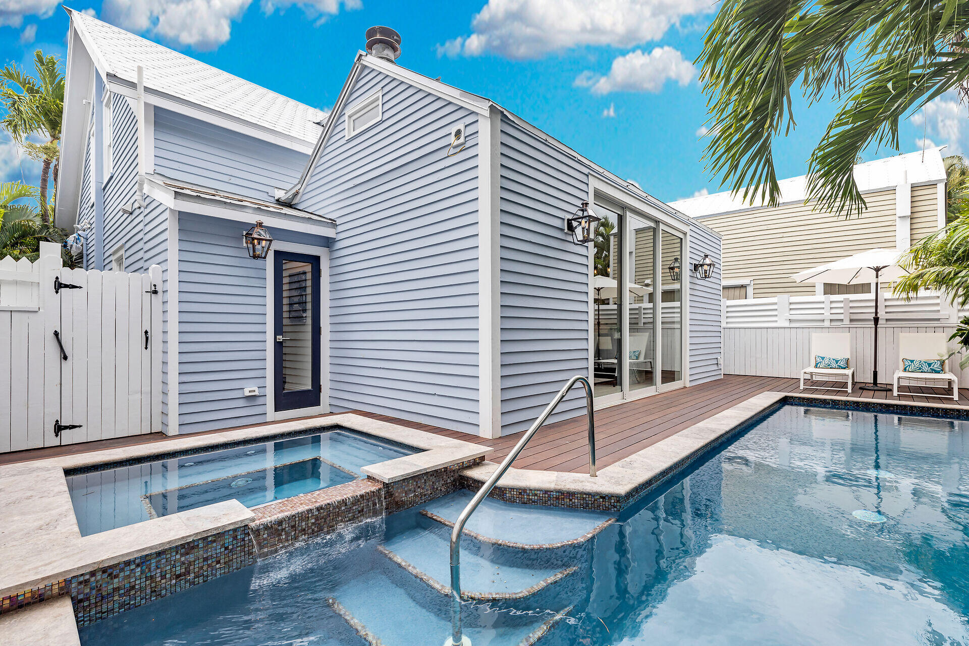 1015 Eaton Street Key West, FL 33040 - Photo 3 of 36 a view of a balcony with two chairs and a table