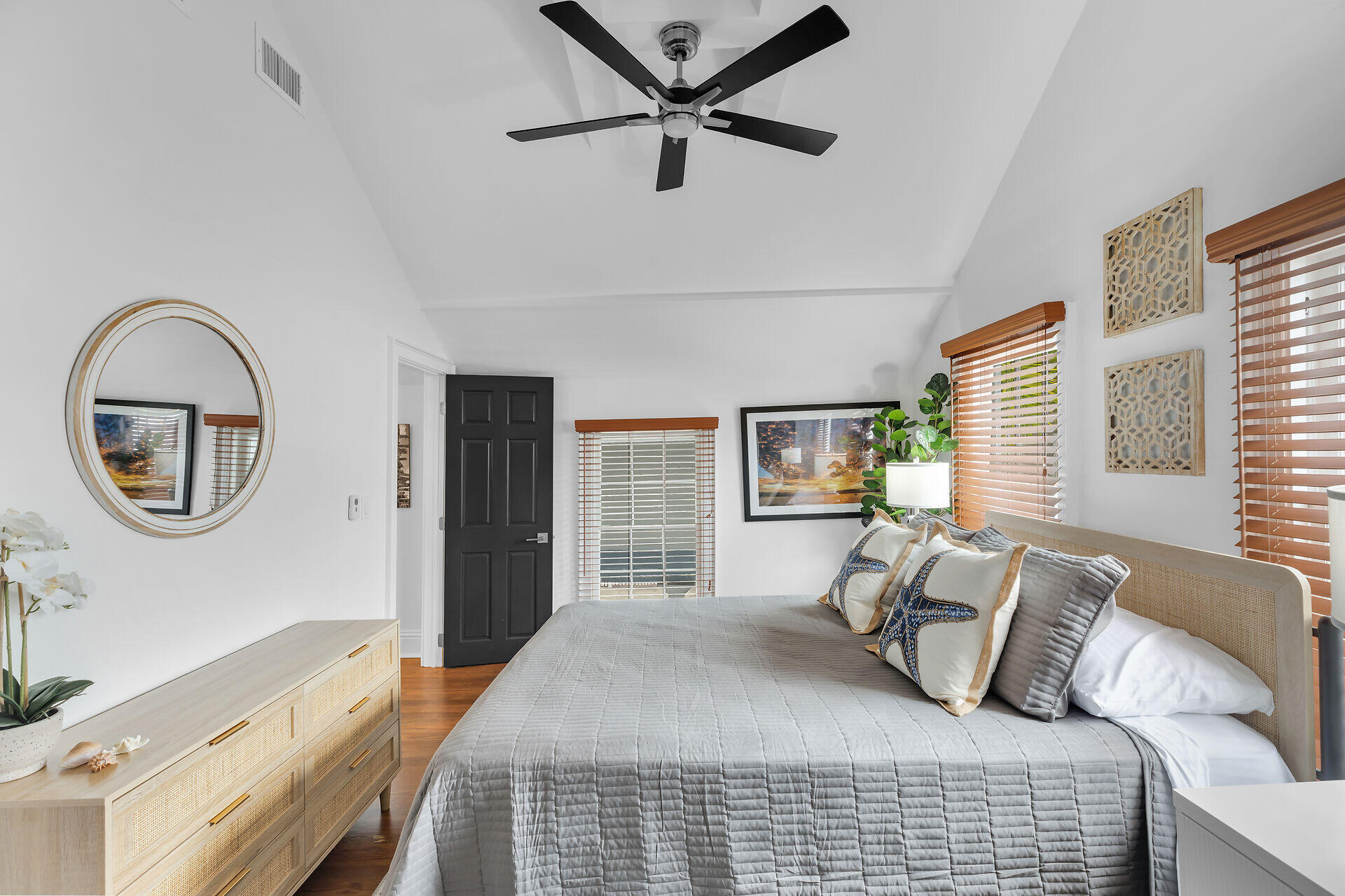 1015 Eaton Street Key West, FL 33040 - Photo 34 of 36 a bedroom with a bed and a large mirror