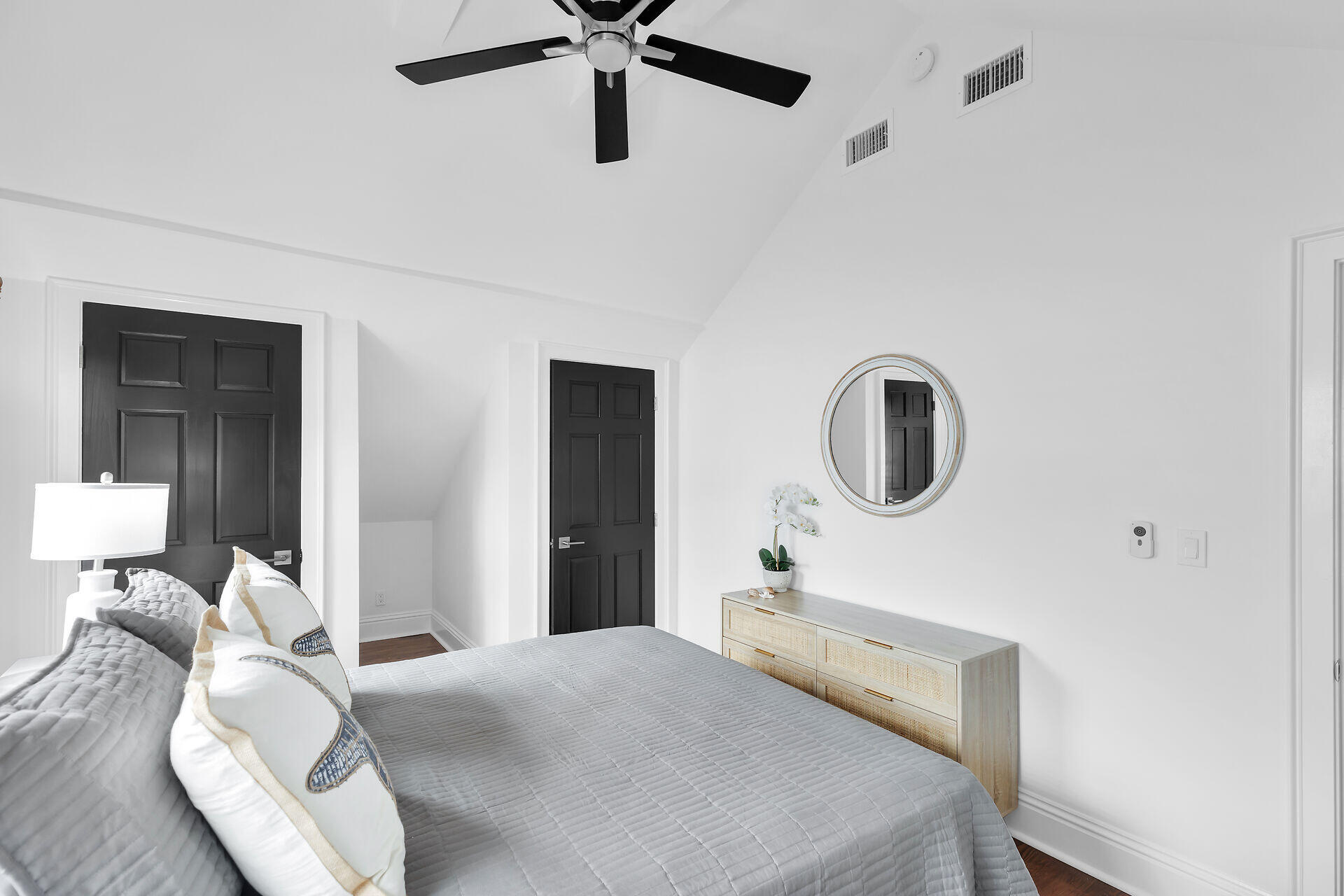 1015 Eaton Street Key West, FL 33040 - Photo 35 of 36 a bedroom with a bed and a chandelier