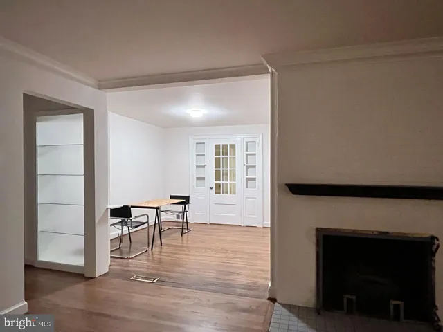 a view of a livingroom with furniture and a fireplace