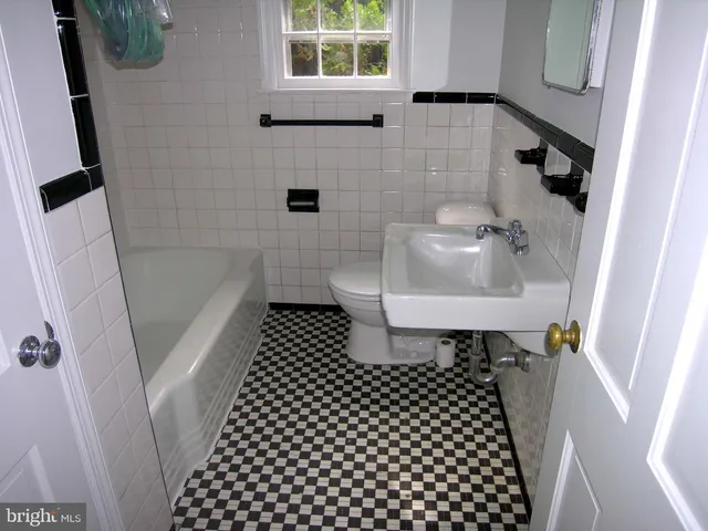 a bathroom with a sink and a shower