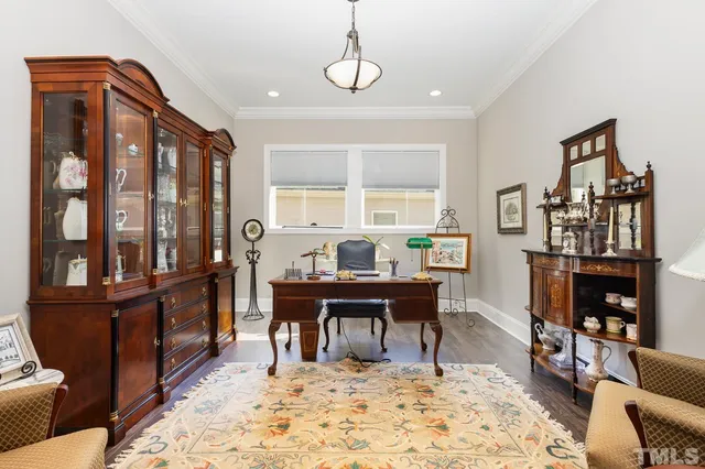 a workspace with furniture window and wooden floor