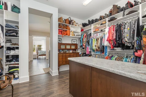 a view of a living room with clothes and shoes