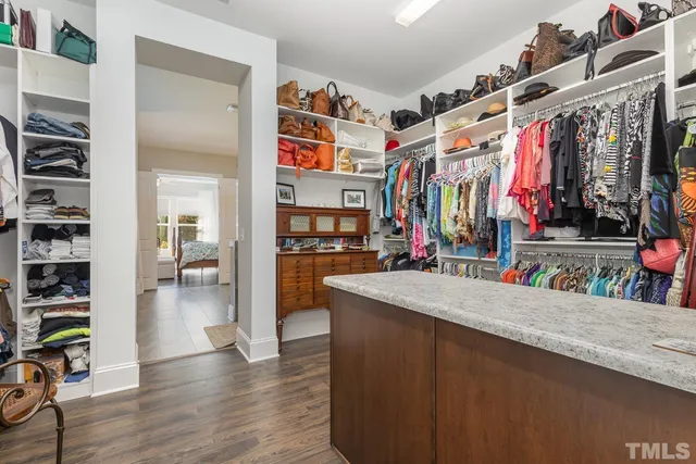 a view of a living room with clothes and shoes