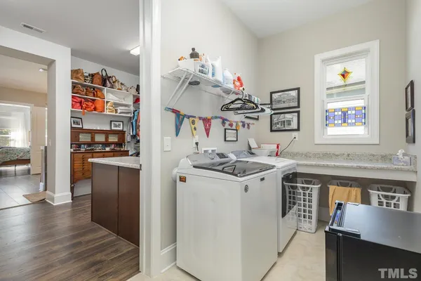 a kitchen with a sink stove and refrigerator