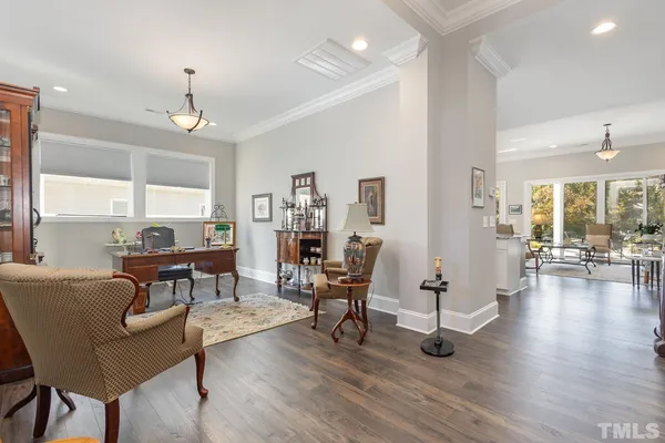 a view of a livingroom with furniture and a table