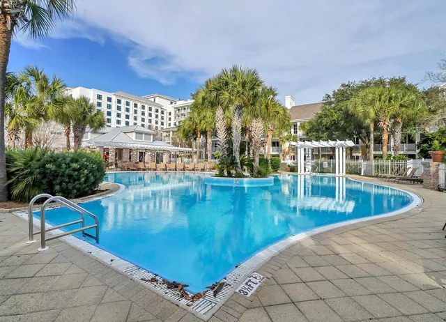 a view of a swimming pool with a patio