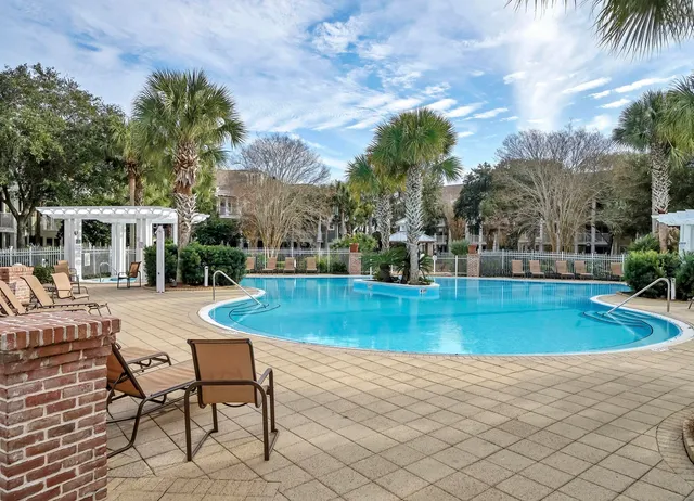 a view of a swimming pool with chairs