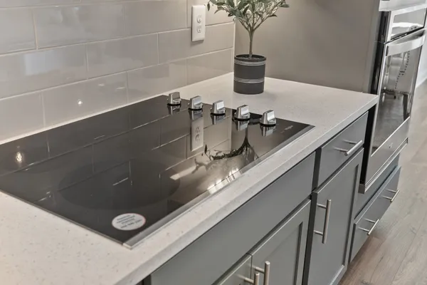 a kitchen with a sink stove and microwave
