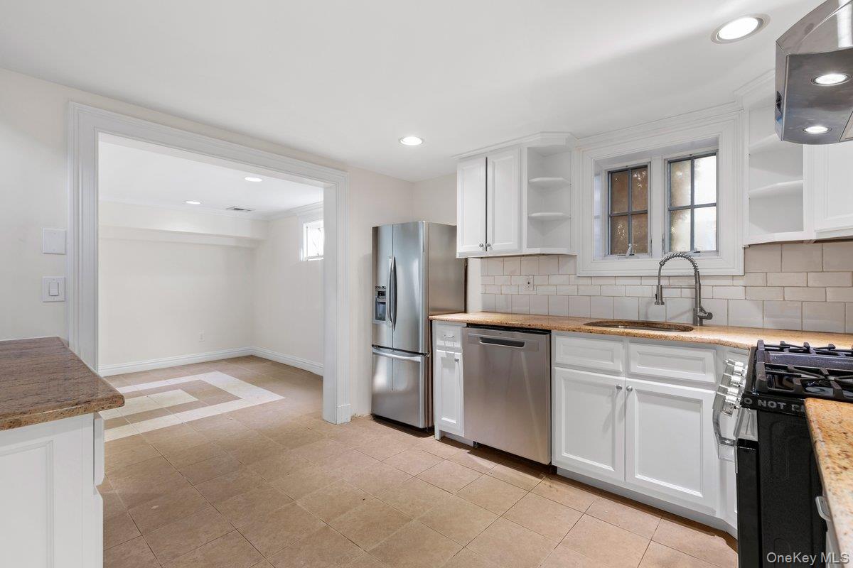 397 Midland Avenue, Unit 397 Rye, NY 10580 - Photo 11 of 16 a kitchen with stainless steel appliances granite countertop a refrigerator and a sink