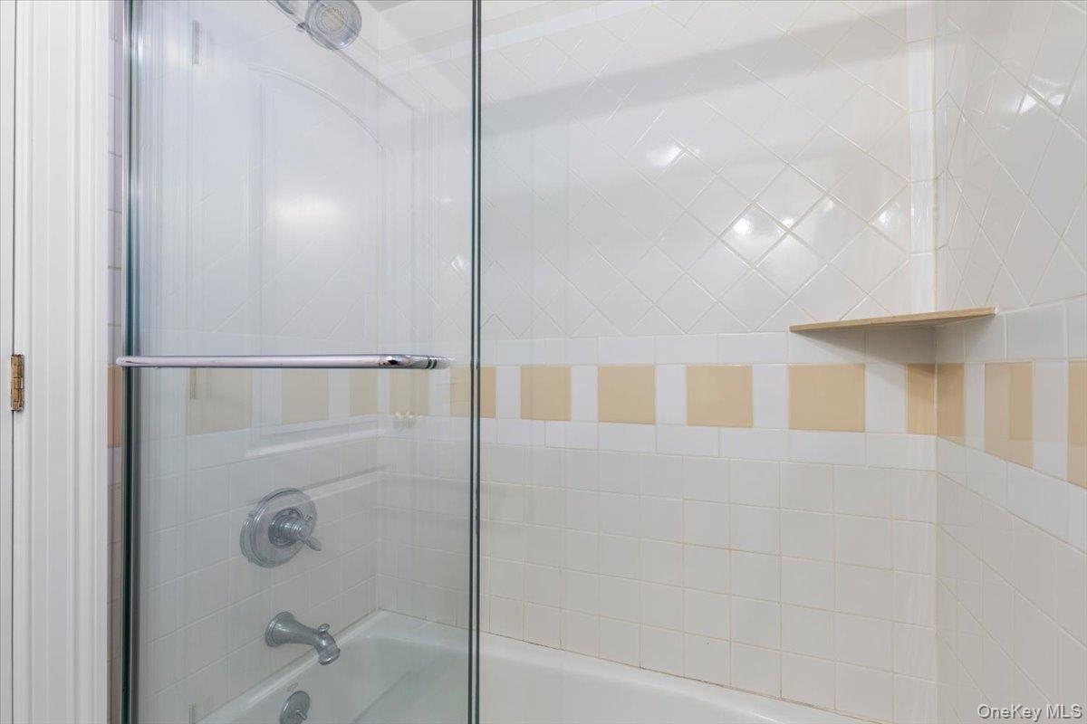 397 Midland Avenue, Unit 397 Rye, NY 10580 - Photo 8 of 16 a bathroom with a shower