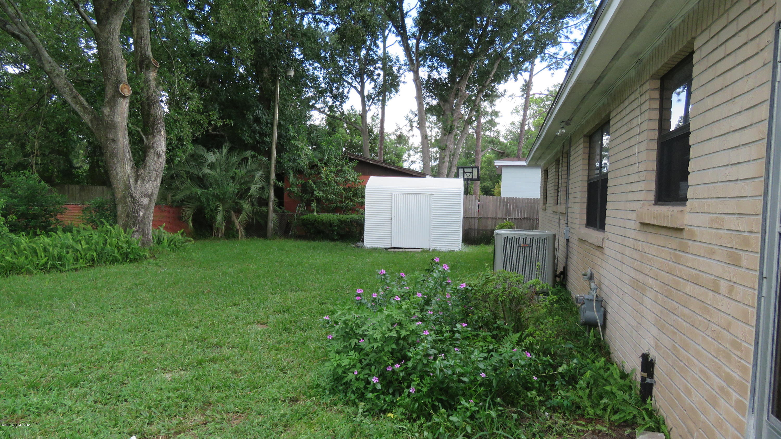 4715 Spring Park Road Jacksonville, FL 32207 - Photo 5 of 12 a view of a backyard