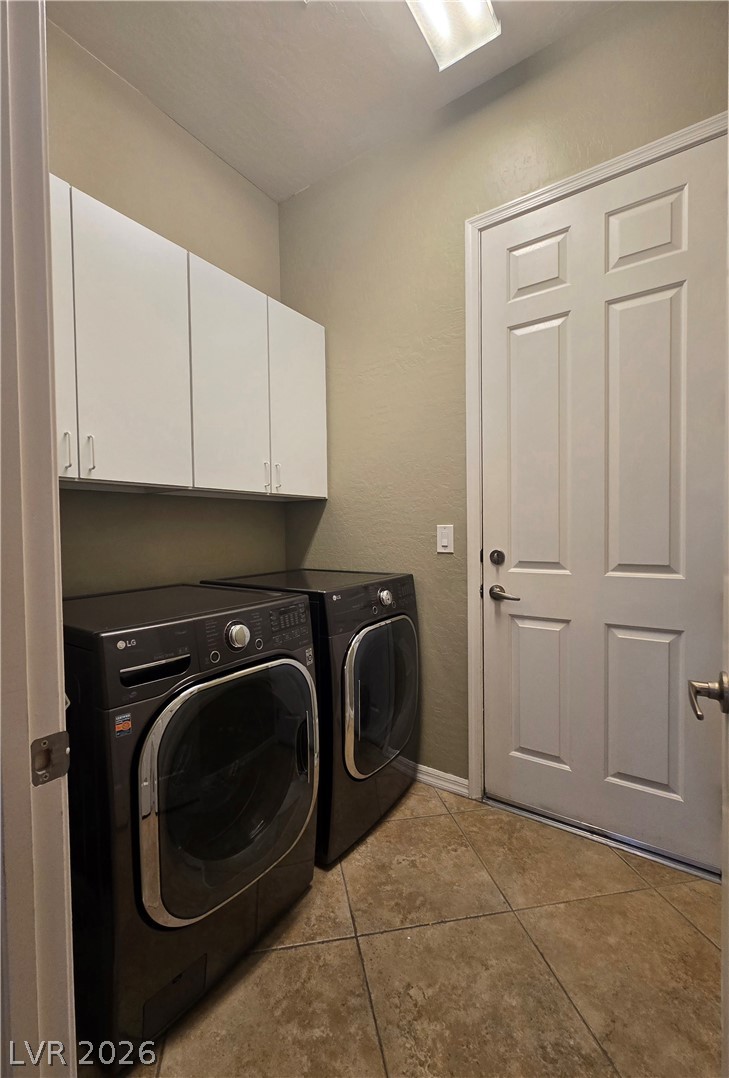 2567 Dirleton Place Henderson, NV 89044 - Photo 64 of 67 Laundry room with cabinets leading to the two-car garage. Functional utility room with ample storage and robust appliances for household chores.
