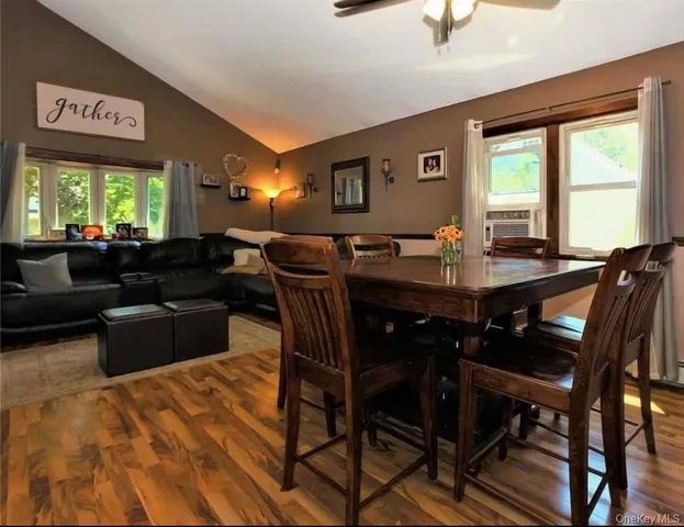 a view of a dining room with furniture window and outside view