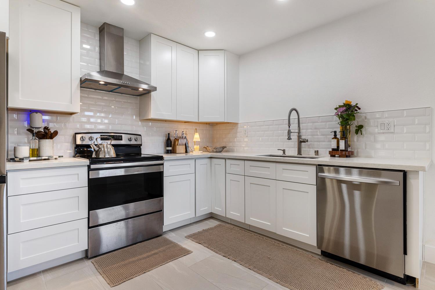 9488 Dunkerrin Way Elk Grove, CA 95758 - Photo 12 of 43 a kitchen with a sink cabinets and appliances