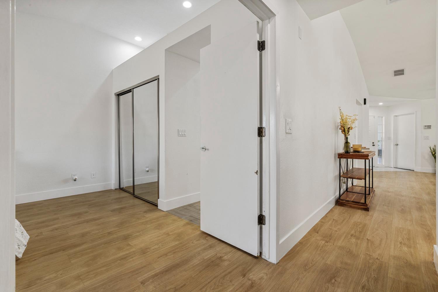 9488 Dunkerrin Way Elk Grove, CA 95758 - Photo 18 of 43 a view of hallway with livingroom and wooden floor